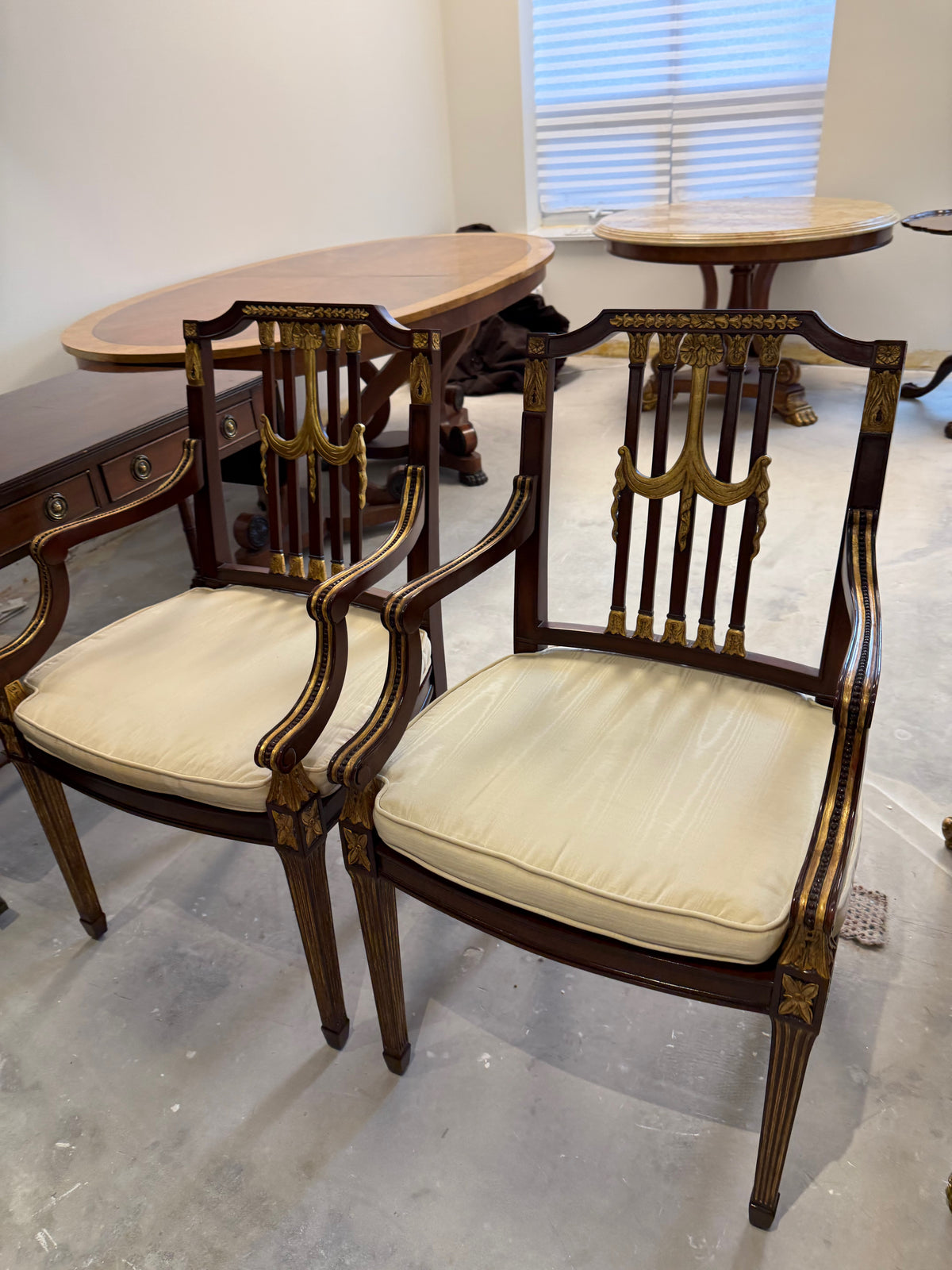 pair of Maitland Smith parcel gilt mahogany and swag shield back cane seat armchairs