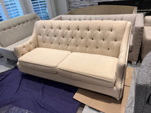 Beige Upholstered Tufted Sofa