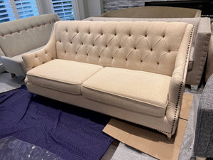 Beige Upholstered Tufted Sofa