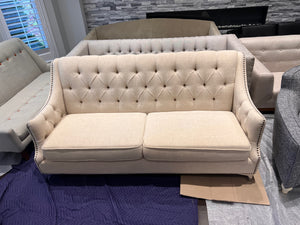 Beige Upholstered Tufted Sofa