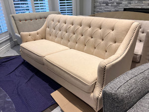 Beige Upholstered Tufted Sofa