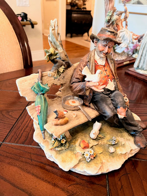 Capodimonte 'Hobo on a bench with birds'