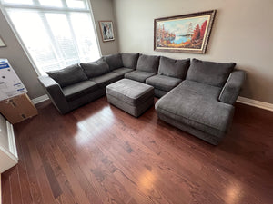 Grey Upholstered Sectional Sofa + Storage Ottoman