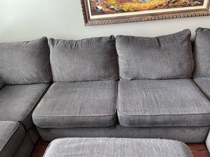 Grey Upholstered Sectional Sofa + Storage Ottoman