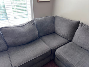 Grey Upholstered Sectional Sofa + Storage Ottoman