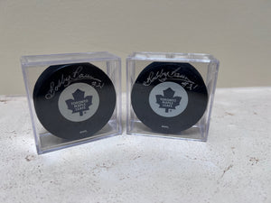 2 Toronto Maple Leafs Pucks Signed by Bobby Baun #21