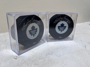 2 Toronto Maple Leafs Pucks Signed by Bobby Baun #21