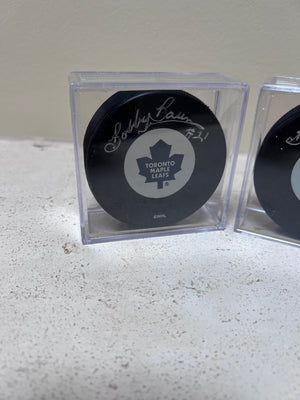 2 Toronto Maple Leafs Pucks Signed by Bobby Baun #21