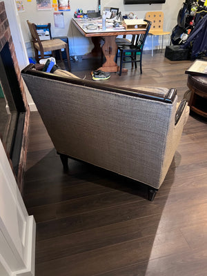 Beige Upholstered, Black Frame Oversized Armchair