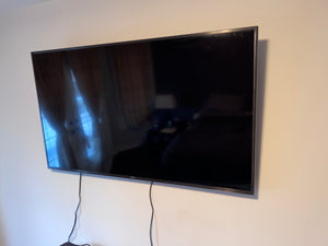 Samsung 55-Inch 4K Ultra HD Smart LED TV.