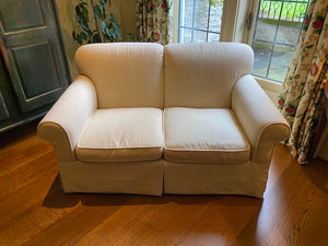 Cream Upholstered Love Seat