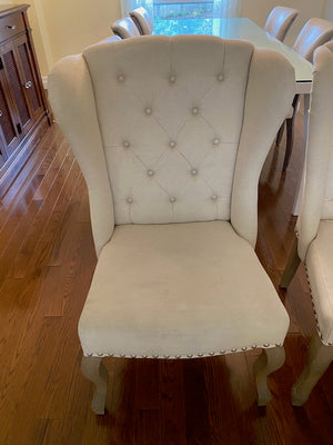 2 Beige Tufted Wingback Upholstered Chairs