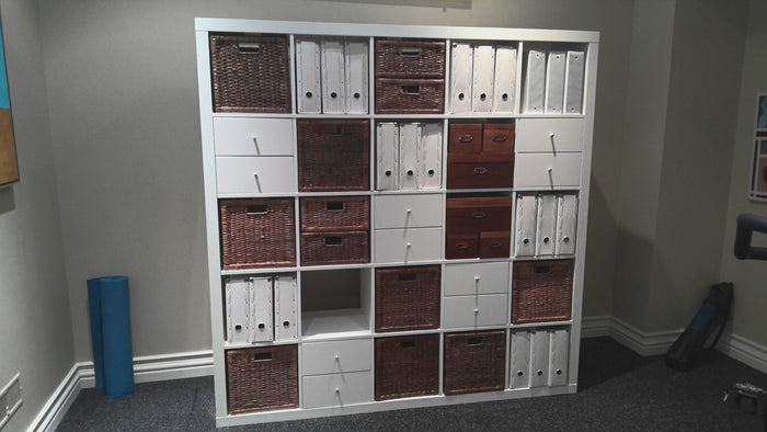 Ikea KALLAX unit with a variety of bin storage